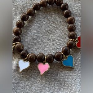 White pink blue and red heart charm bracelet with brown beads